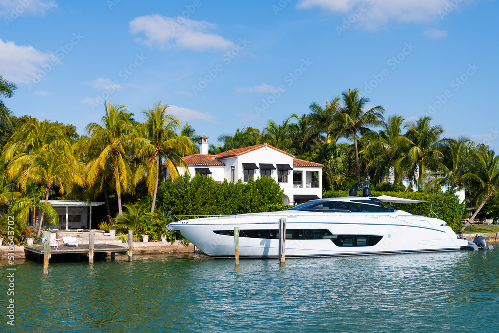 luxury private boat in miami bay with palm trees