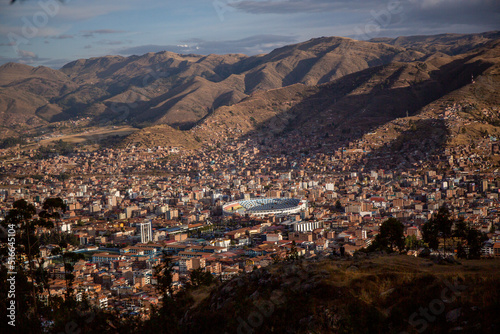 Aerial view of the city of Cusco in a cloudy sky day, Peru