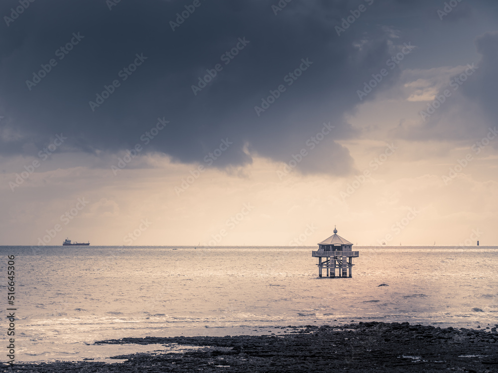 Obraz premium La rochelle, France, July 2022. View of the CAP HORN - The building is reproduced from the novel by Jules Vern - The Lighthouse at the End of the World. dramatic sky