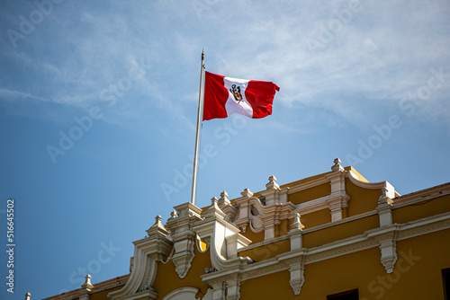 Peru flag waving in the blue sky