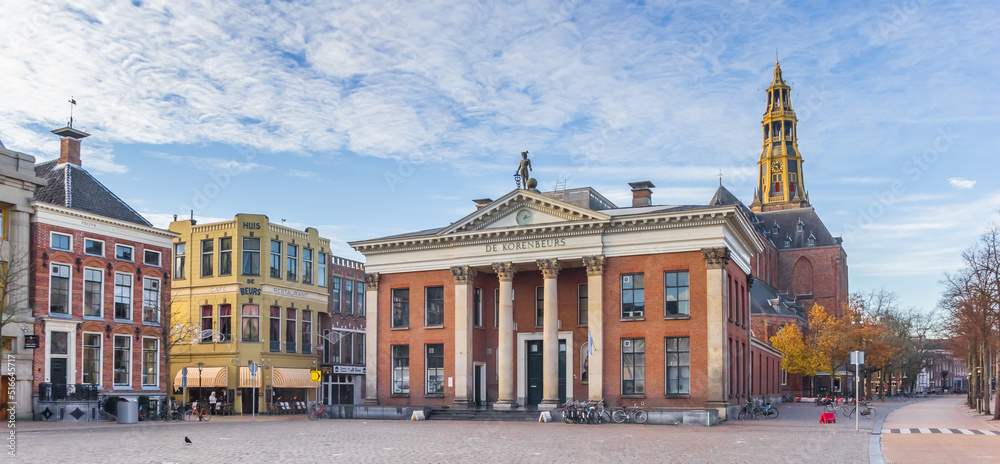 Panorama of the grain exchange building and church tower at the fish market square in Groningen, Netherlands