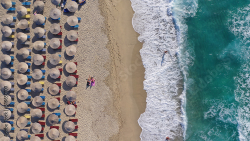 Aerial drone photo of famous bay and organised sandy beach of Livadi Armenistis, popular for surfing sports, Ikaria island, Northeast Aegean, Greece