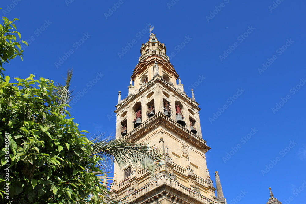 Tower of the Mezquita Cathedral of Cordoba on a bright sunny day, Spain.