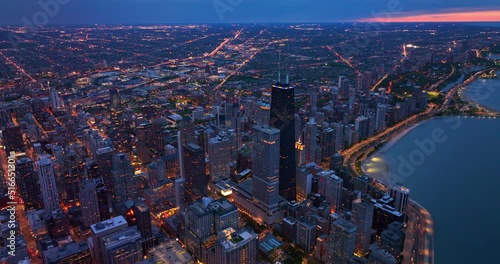 Vast panorama of outstanding Chicago full of lights at evening time. Beautiful metropolis downtown at the waterfront of Lake Michigan. Top view. photo