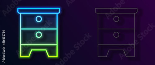 Glowing neon line Furniture nightstand icon isolated on black background. Vector