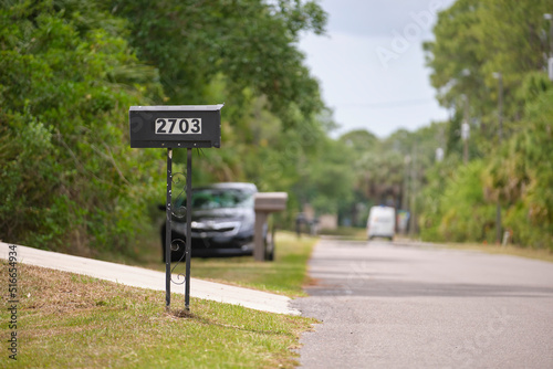 Typical american outdoors mail box on suburban street side