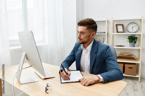 manager sitting at the computer work boss documentation isolated background