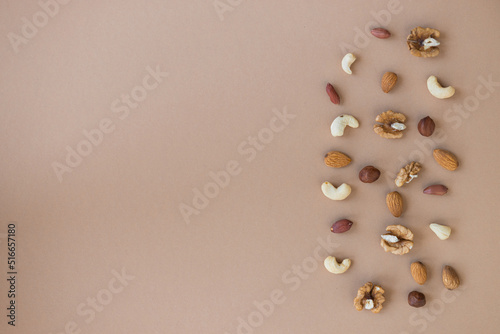 nuts mix for a healthy diet cashew  peanut  hazelnuts  walnuts  almonds on brown background