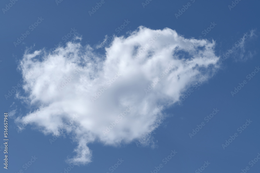 One white cloud in the blue sky. One white cloud in the blue sky.