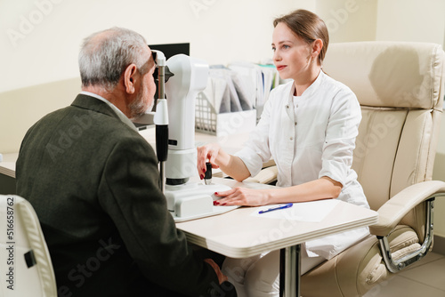 ophthalmologist examination of elderly man on corneo topographer.modern clinic