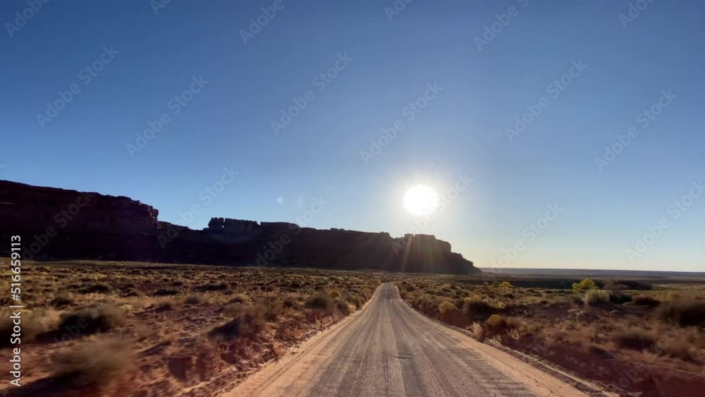 Driving past the amazing rock formations of the Valley of the Gods in Southern Utah Driving past the amazing rock formations of the Valley of the Gods in Southern Utah