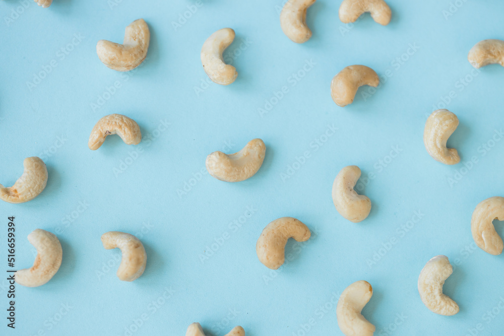 Cashew nuts isolated on blue background