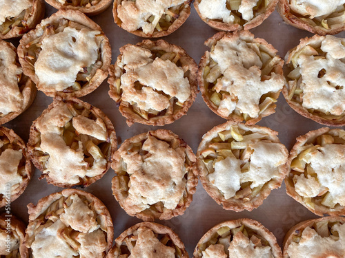 Baked mini apple pies - view from the top, pattern, closeup