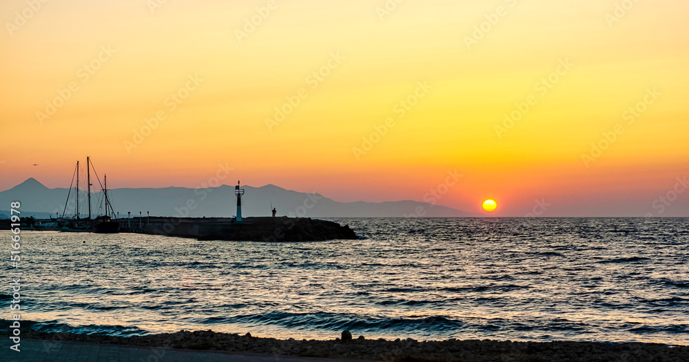 Sunset over the sea in Gouves, Crete, Greece Sunset over the sea in Gouves, Crete, Greece