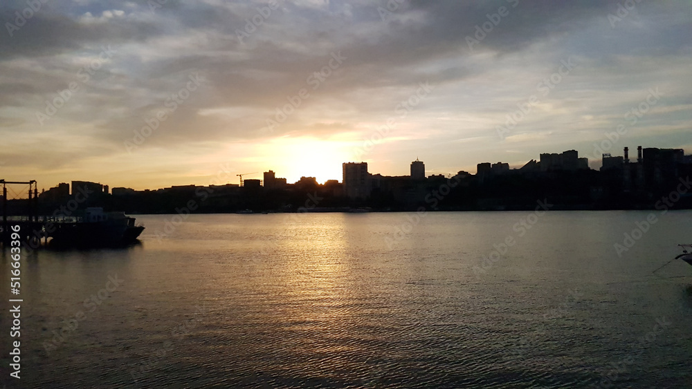 sunset over the port city. siluet cities