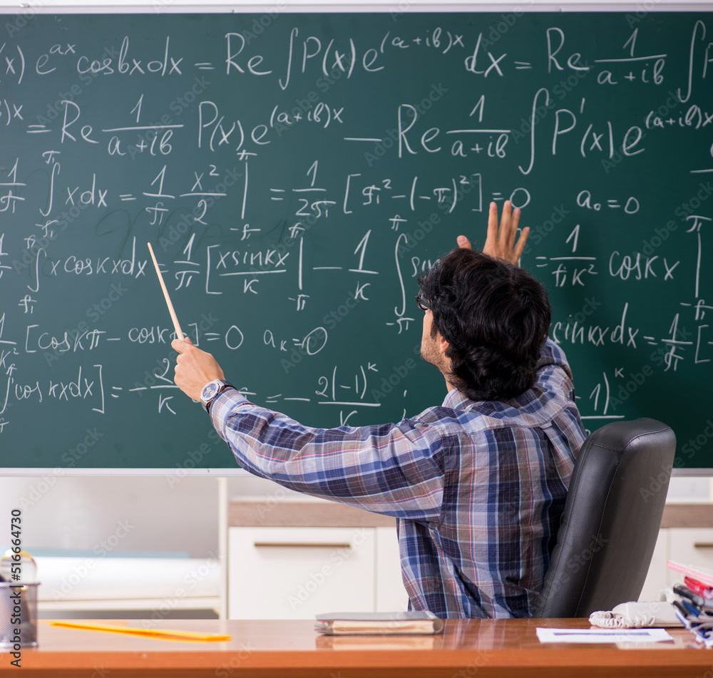 Funny male math teacher in the classroom Funny male math teacher in the classroom