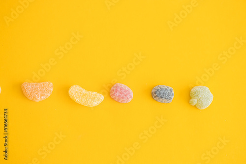 jelly color fruit sweets on yellow background