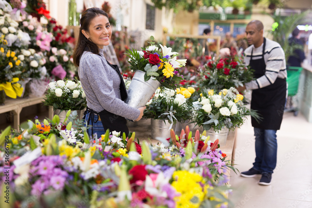 Flower seller prepares a luxury bouquet at a flower shop