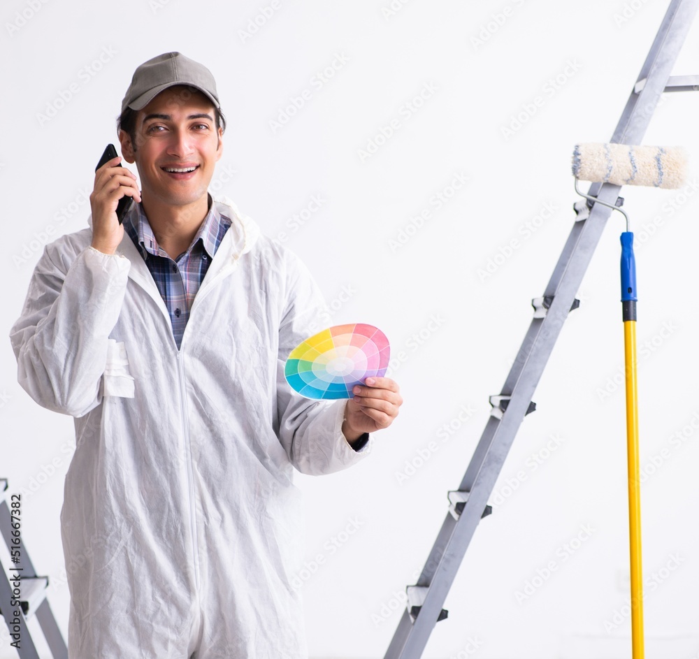 Painter working at construction site Painter working at construction site