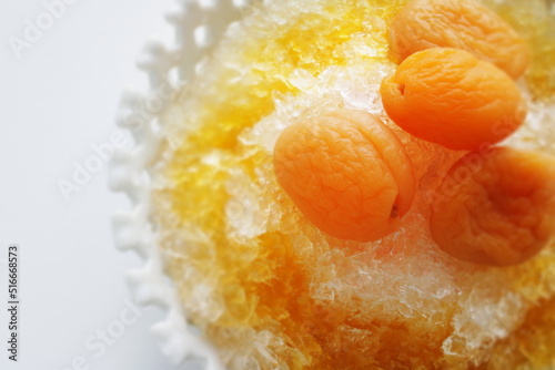 Korean street food, shaved ice Bingsu severed with dried apricot and sweet honey sauce