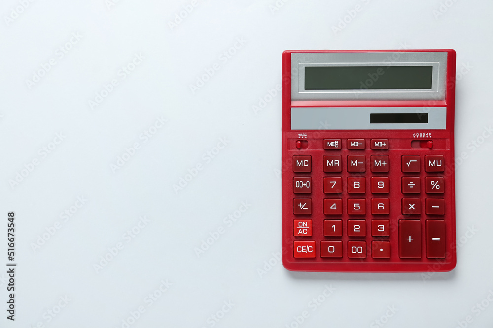 Red calculator on light background, top view. Space for text Red calculator on light background, top view. Space for text