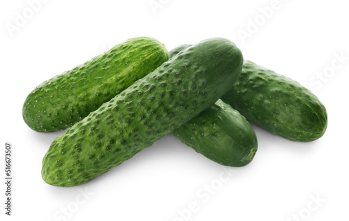 Whole fresh green cucumbers on white background