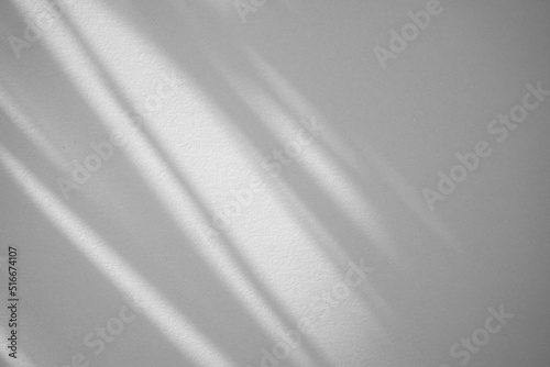 Natural organic shadow from window in room overlay on silver grey abstract texture background. Light and shadow effect. Simple and minimal for your design, or any purposes.