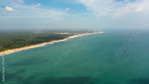 Tropical landscape with beautiful sandy beach and blue sea. Sri Lanka. © Alex Traveler