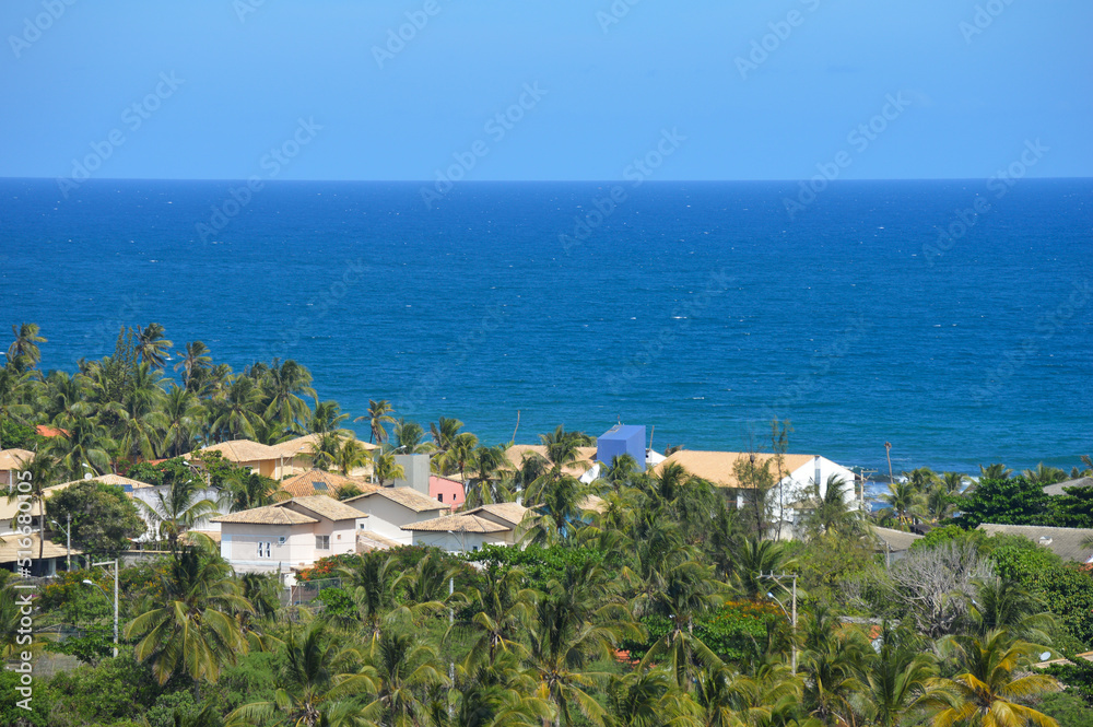 Landscape of a blue ocean and green trees at Salvador