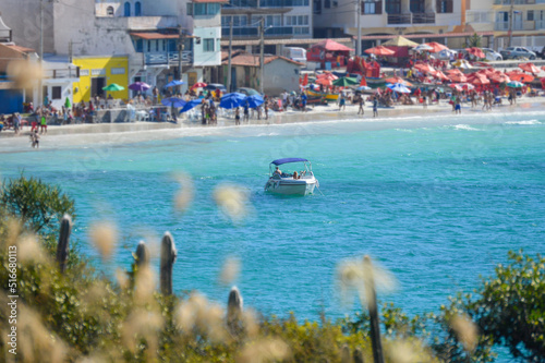 White boat on a beautiful blue ocean at Arraial do Cabo, Brazil