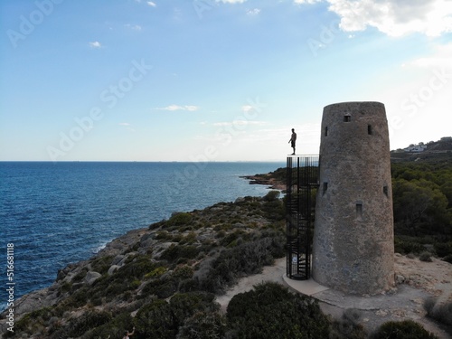 Man standing on top of a watchtower