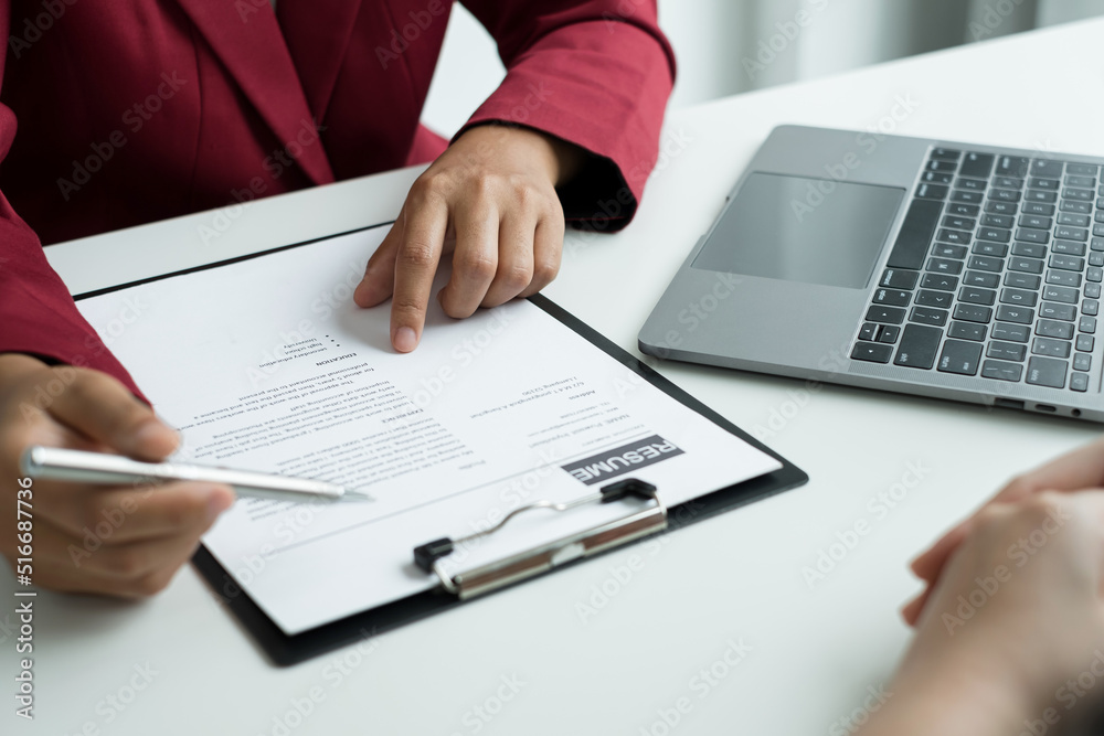 Business people hold a resume and talk to job applicants for job interviews about careers and Their personal history in the company. Recruitment concepts Business people hold a resume and talk to job applicants for job interviews about careers and Their personal history in the company. Recruitment concepts
