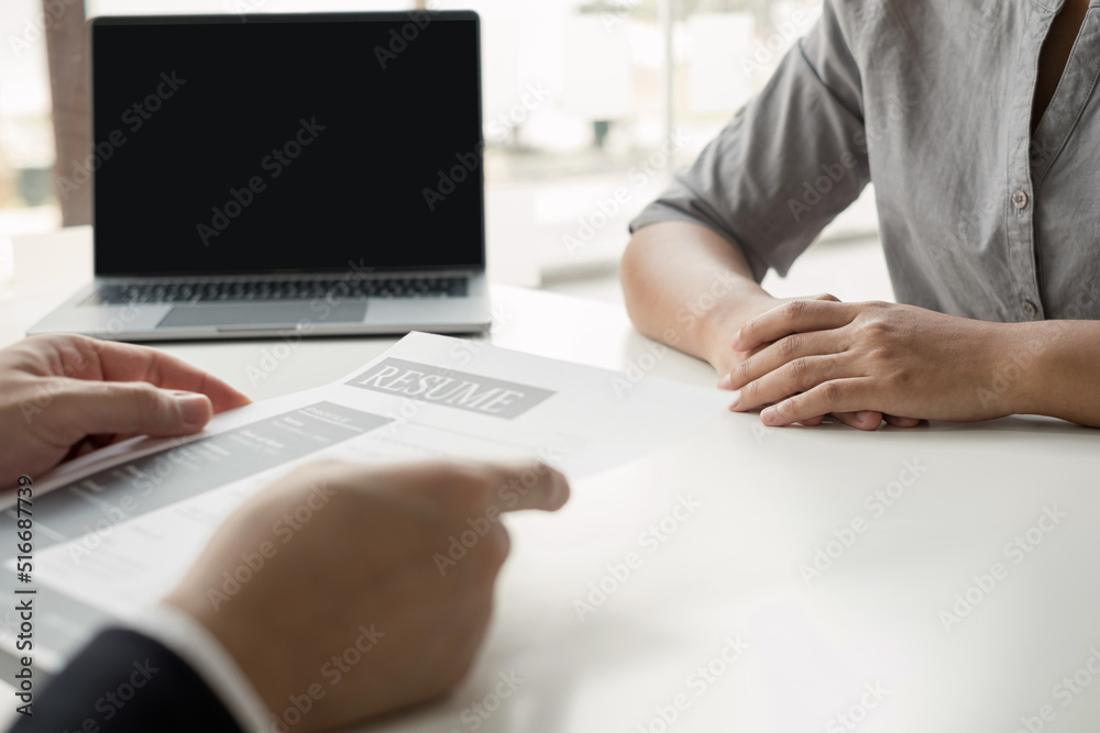 Fototapeta premium Business people hold a resume and talk to job applicants for job interviews about careers and Their personal history in the company. Recruitment concepts