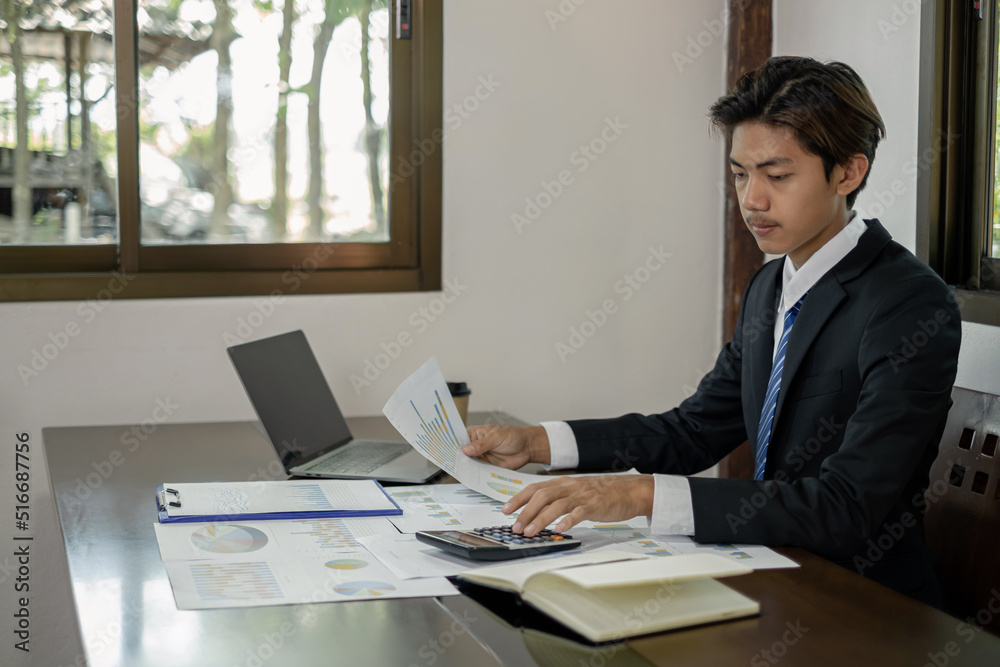 Businessman or financial market analysts work and calculate financial graphs that show investment results planning the process of successful business growth Businessman or financial market analysts work and calculate financial graphs that show investment results planning the process of successful business growth