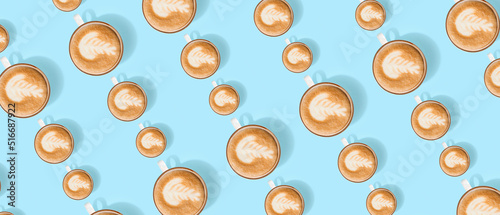 Many cups of coffee on ligh...