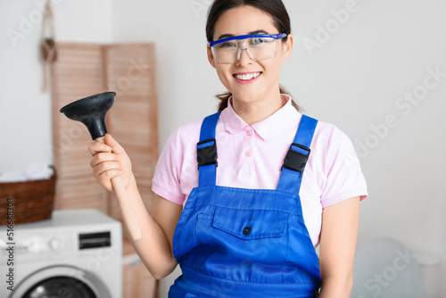 Asian female plumber with p...