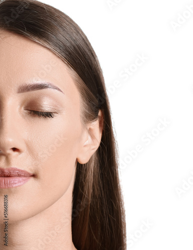 Young tanned woman on white...