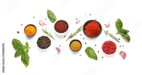 Fototapeta Naklejka Na Ścianę i Meble -  Composition with bowls of different spices and herbs on white background