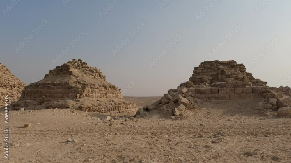 Triangular rock formations at the Pyramid of Queens, in sunny Giza complex, Egypt - pan view Triangular rock formations at the Pyramid of Queens, in sunny Giza complex, Egypt - pan view