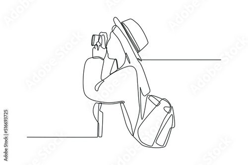 Continuous one line drawing young woman having fun taking pictures with photo camera. World tourism day concept. Single line draw design vector graphic illustration.