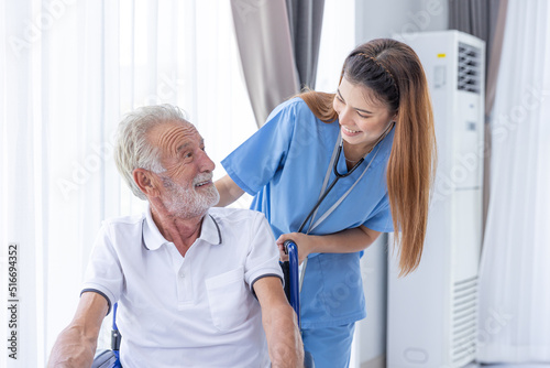 Nurse Medical Team Staff Working Support Service Health Care Senior Elderly Man on Wheel Chair in Home Care.