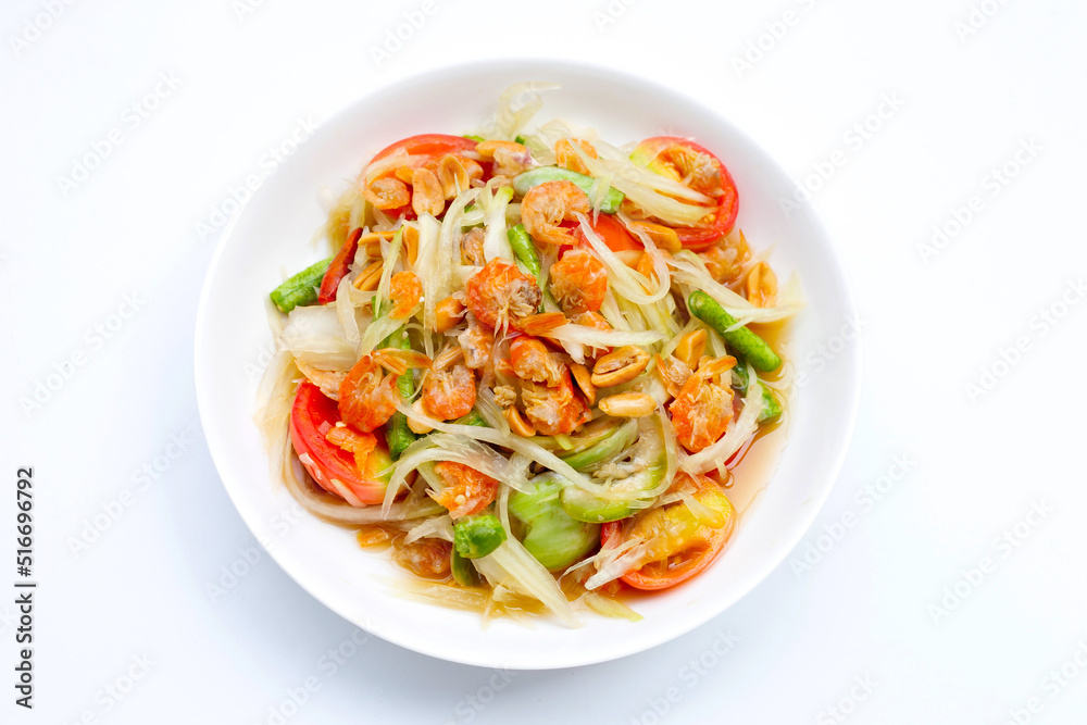 Dish of spicy papaya salad on white. Dish of spicy papaya salad on white.