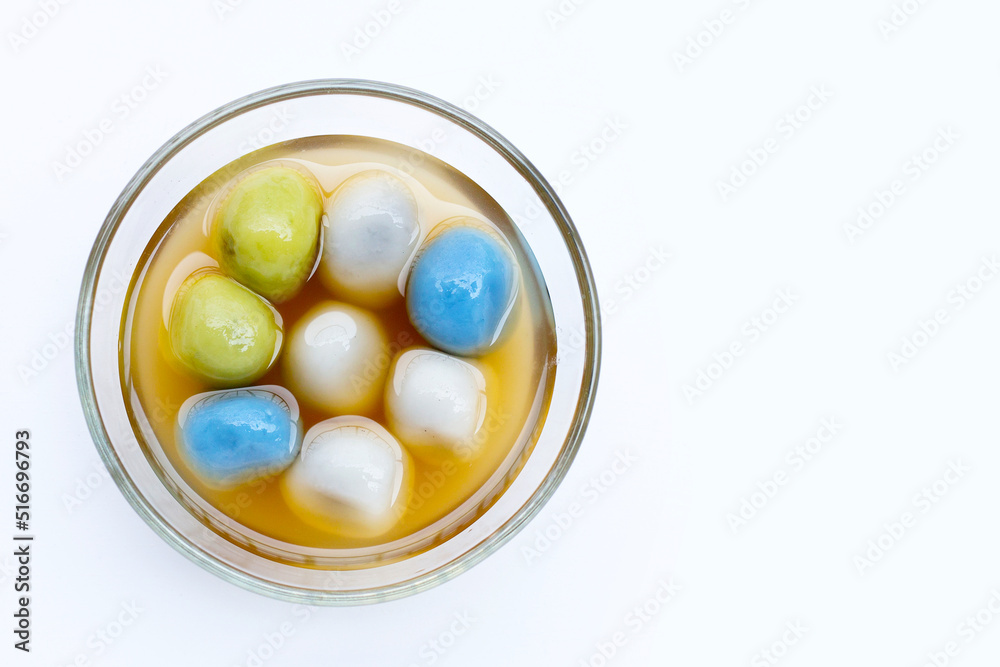 Black sesame dumpling in ginger tea recipes in glass bowl on white background. Black sesame dumpling in ginger tea recipes in glass bowl on white background.