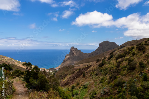 Panoramic view on Roque de las Animas crag and Roque en Medio in the Anaga mountain range, north coast of Tenerife, Canary Islands, Spain, Europe. Hiking trail from Afur to Taganana. Atlantic Ocean © Chris