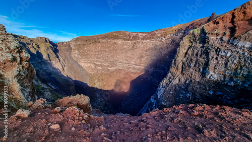 Panoramic view on the edge of the active volcano crater of Mount Vesuvius, Province of Naples, Campania region, Southern Italy, Europe, EU. Volcanic landscape full of stones, ashes and solidified lava