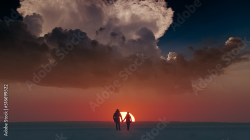 The two travelers walking through the arctic snowy field on sunset background © Artem