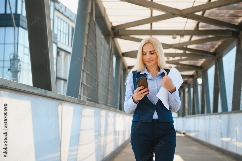Portrait of a business woman using a cell phone Portrait of a business woman using a cell phone