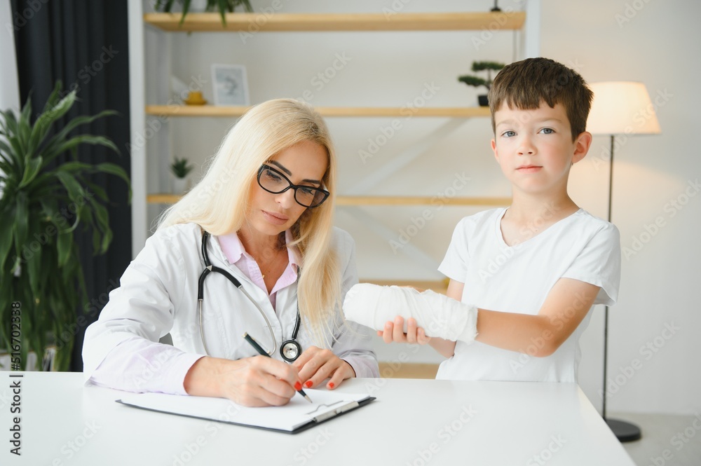 A child with a plaster on his hand at clinic A child with a plaster on his hand at clinic