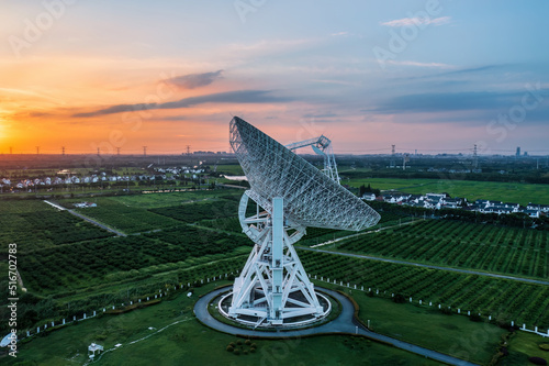 Canvas Print Aerial view of astronomical radio telescope and beautiful sky clouds at sunset