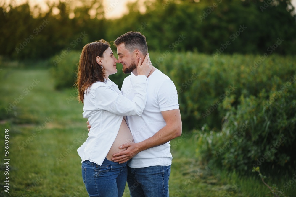 Pregnant woman with her family looking happy Pregnant woman with her family looking happy